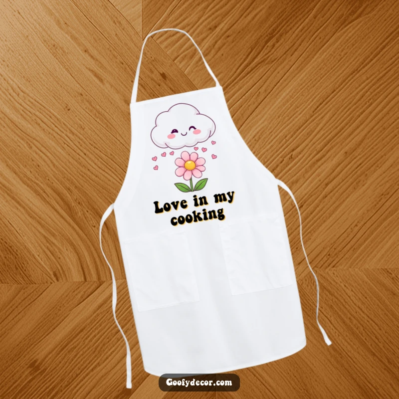 Funny apron showing a smiling cloud character raining small hearts onto a happy flower.
