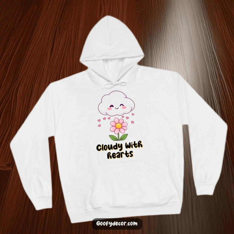 Funny hoodie depicting a smiling cloud character raining small hearts onto a beaming flower.
