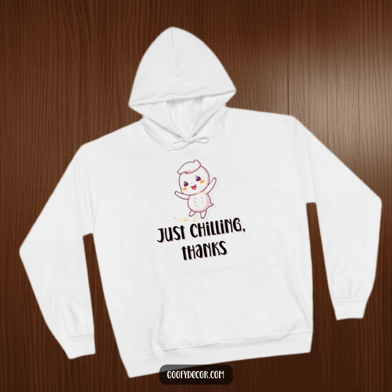 Funny hoodie depicting a giggling snowflake character playfully twirling in a gentle, cool breeze, ideal for winter.