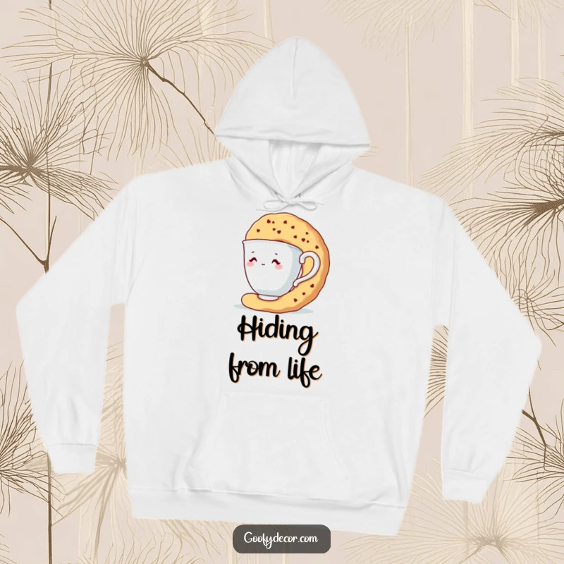 Funny hoodie depicting a shy teacup character using a giant biscuit as a shield.