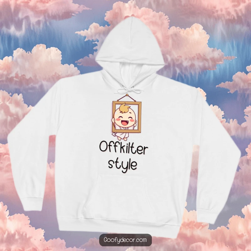 Funny hoodie featuring a delighted character's comical attempt to hang a crooked picture, a humorous take on home decor.