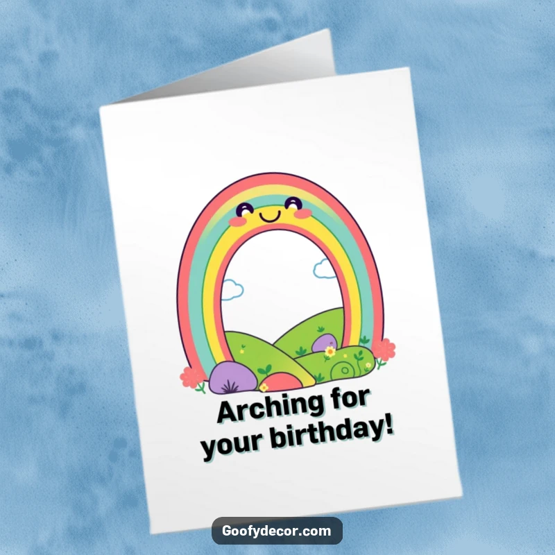 Cheerful Free Printable Birthday Card: A playful rainbow character with a big smile arches over a happy, sunny landscape.