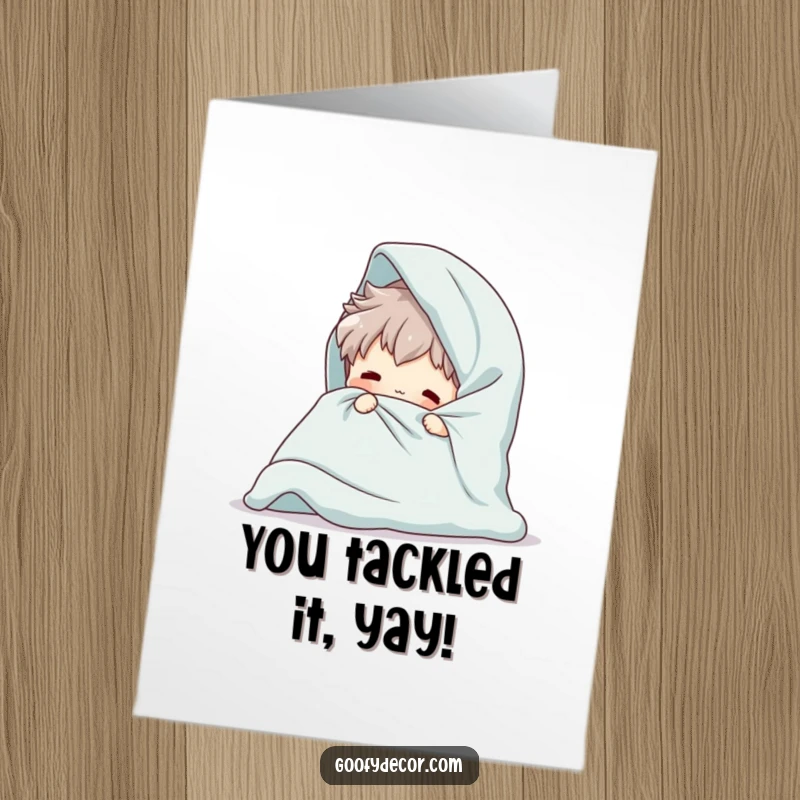 Funny Free Printable Congratulations Card shows a playful character hilariously failing to fold an overwhelmingly large blanket.