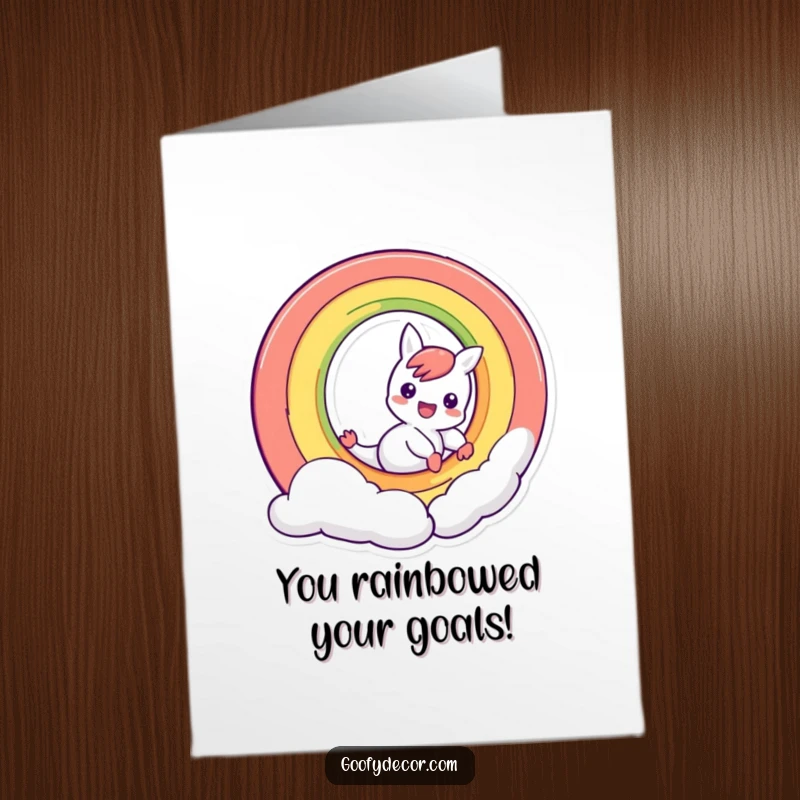 Free Printable Congratulations Card: A mischievous rainbow character sliding down its arc, celebrating a successful achievement.