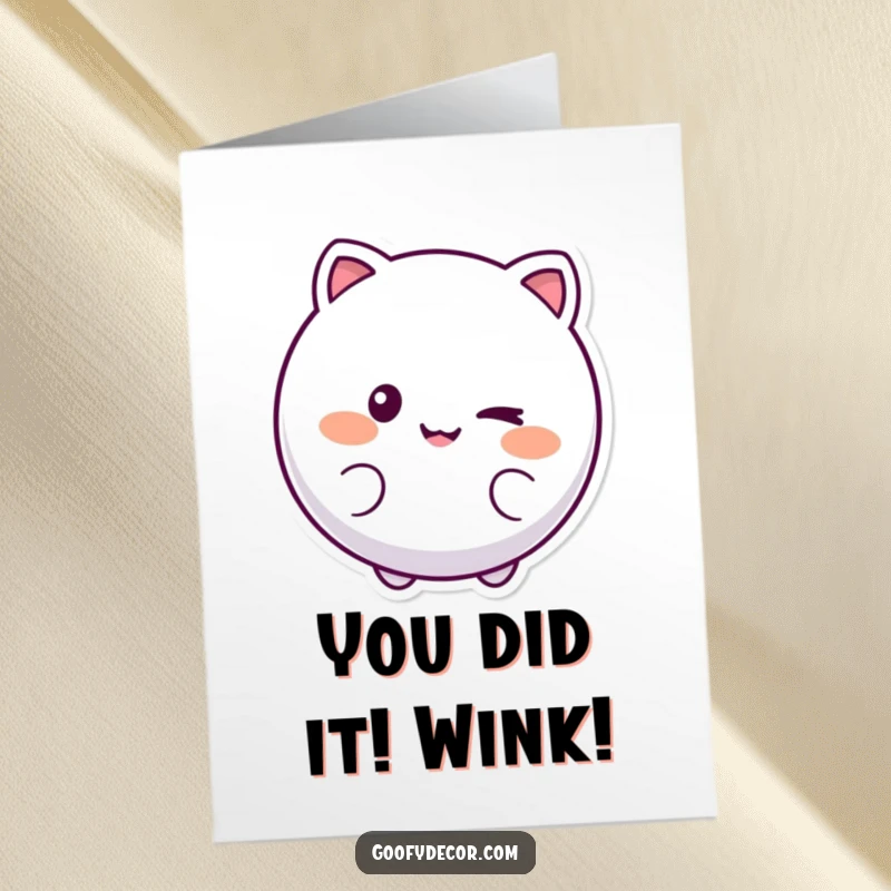 Funny Free Printable Congratulations Card with a round, smiling character winking, symbolizing playful success and good fortune.