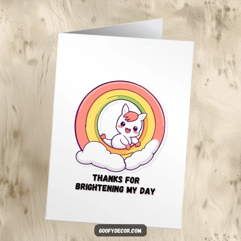 Funny Free Printable Thank You Card: A mischievous rainbow character sliding down its arc, sending colorful thanks.