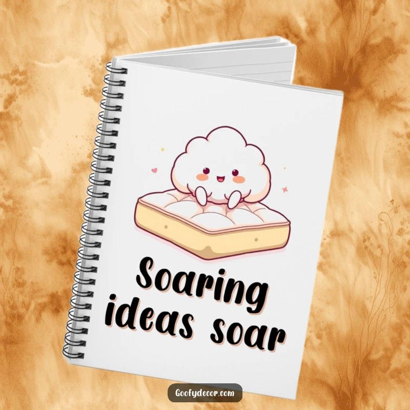 Funny notebook with a giddy cloud character joyfully bouncing on a fluffy mattress, ideal for writing and notes.