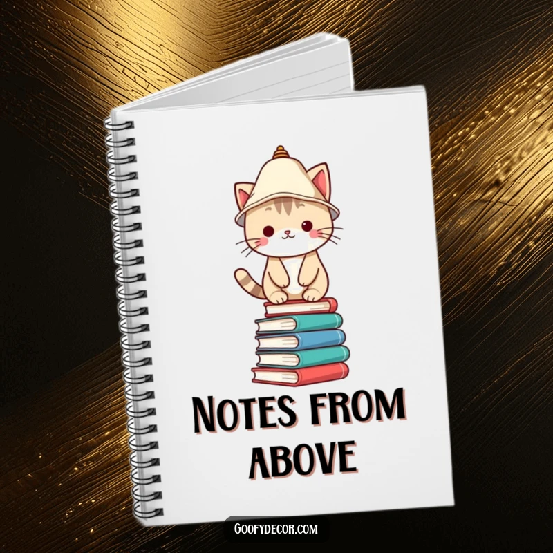 Funny Notebook featuring a Kawaii cat character wearing a lampshade hat, precariously balanced on books, perfect for journaling.