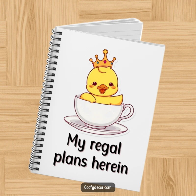 Funny notebook with a crowned rubber ducky sailing in a teacup, ideal for writing, planning, and note-taking with a whimsical touch.