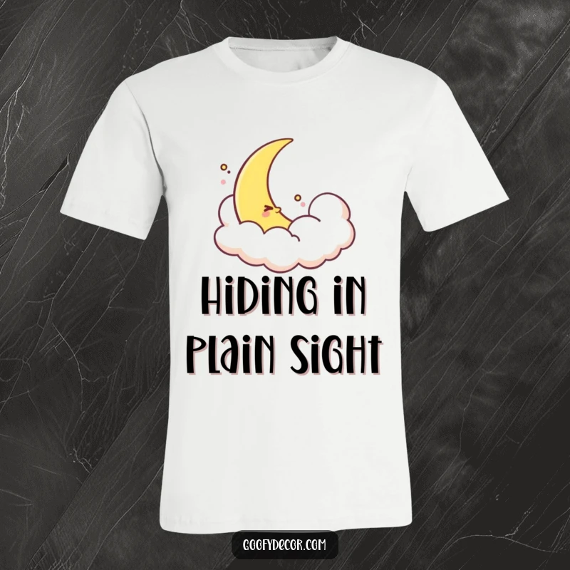 Funny shy moon t-shirt featuring a cute crescent moon character peeking shyly from behind a soft, fluffy cloud. Ideal for relaxed wear.