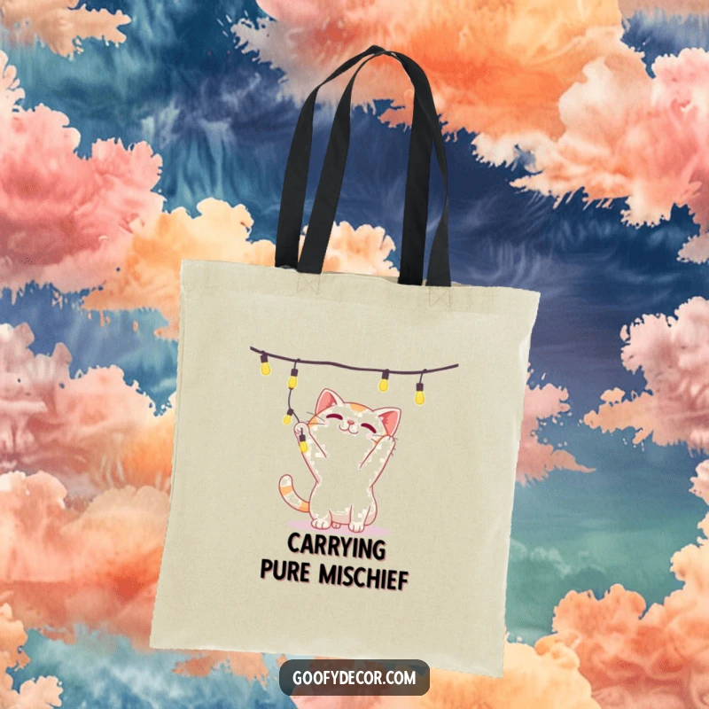 Funny tote bag depicting a playful cat character batting energetically at a strand of shiny, dangling decorative lights.