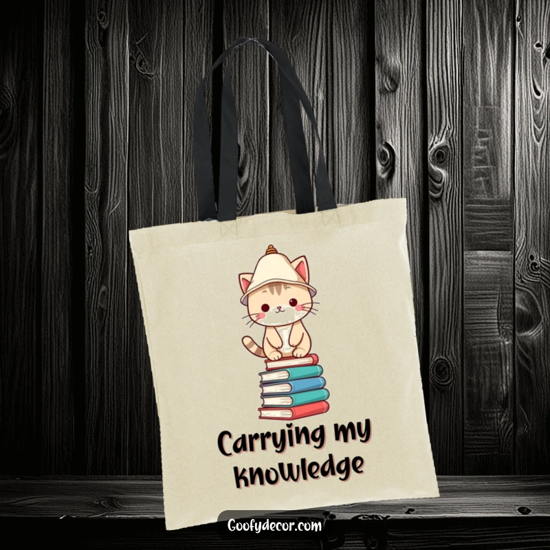 Funny Tote Bag showcasing a Kawaii cat character in a lampshade hat, balancing on books, perfect for carrying essentials with style.